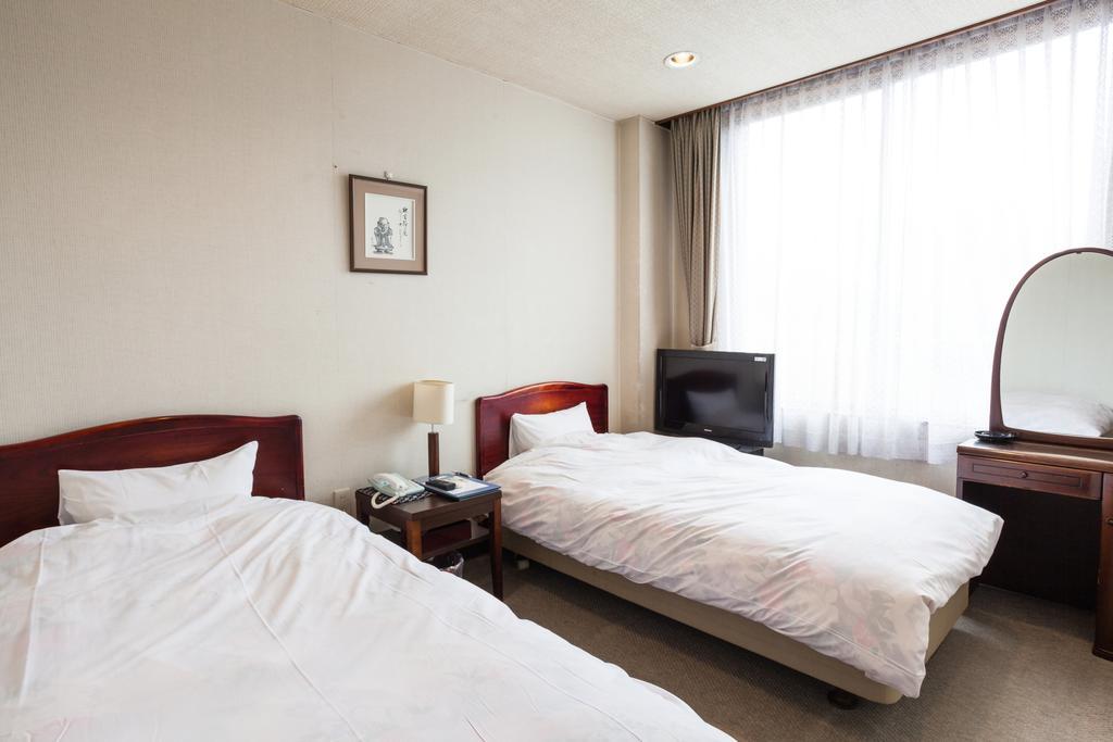 Hotel Mikunitoge Onsen Oyado Honjin à Yuzawa  Extérieur photo